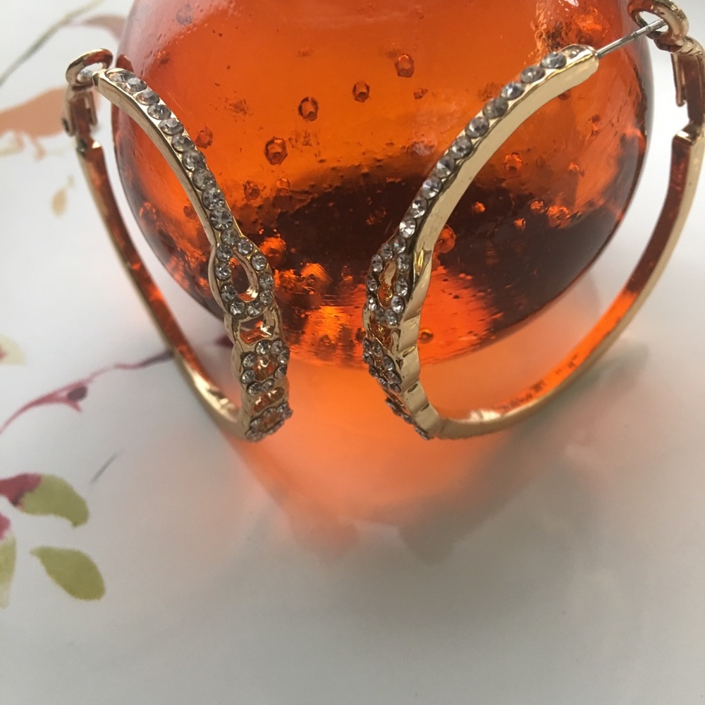 Guess gold costume hoops with Crystal insets.